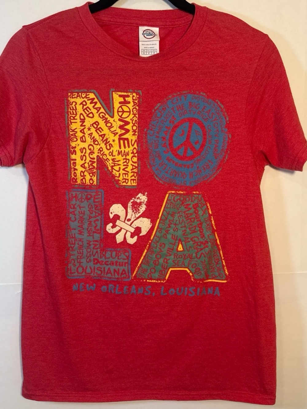 Delta Red NOLA Graphic Tee with Yellow & Blue Accents